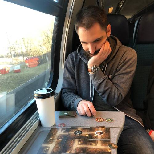 Photo of Ivan playing a board game in the train